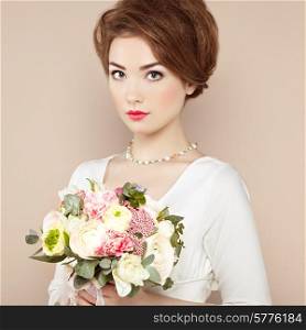 Woman with bouquet of flowers in her hands. Flowers. Spring. Bride. March 8. Fashion photo