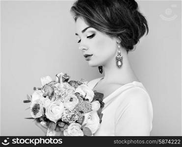 Woman with bouquet of flowers in her hands. Flowers. Spring. Bride. March 8. Fashion photo. Black and white