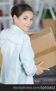 woman with box at home