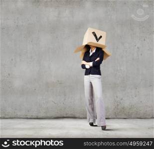 Woman with box. Confident businesswoman wearing carton box on head