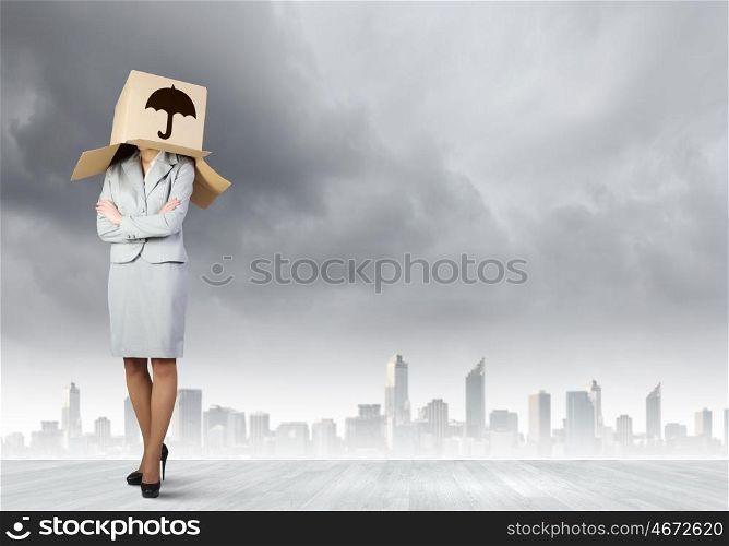 Woman with box on head. Businesswoman wearing carton box with sign on head