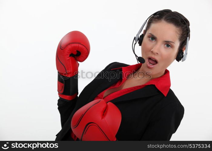 Woman with boxing gloves and helmet