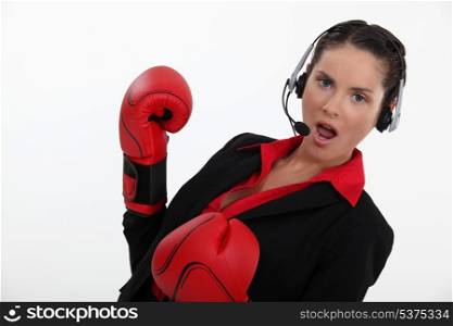 Woman with boxing gloves and helmet