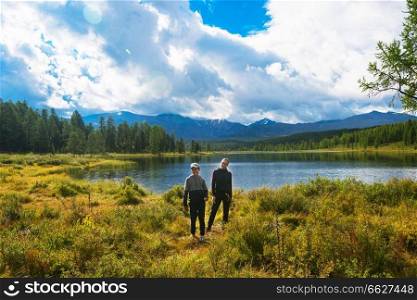 Woman with boy at Lake in the Altai Mountains, Siberia. Woman with boy Lake in the Altai Mountains