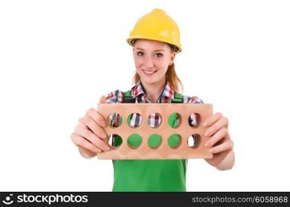 Woman with bricks isolated on white