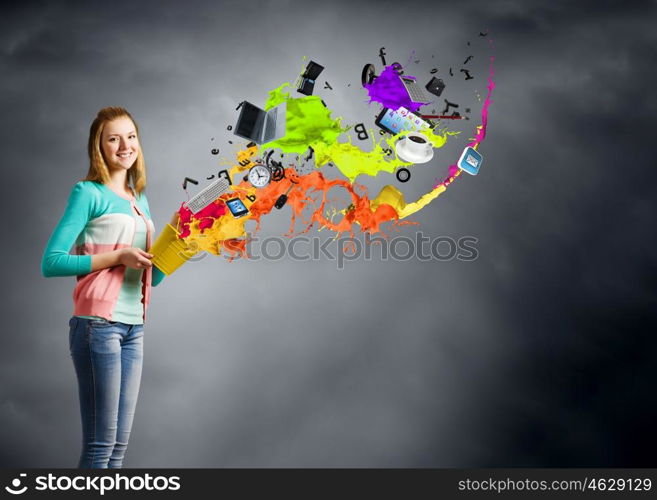 Woman with bucket. Young woman in casual holding yellow bucket with icons