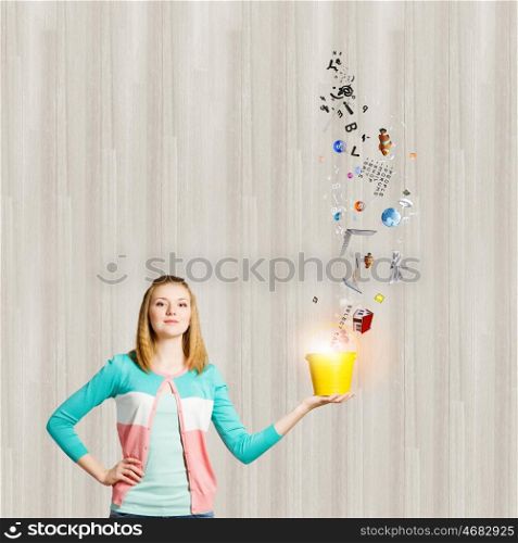 Woman with bucket. Young woman in casual holding yellow bucket with icons