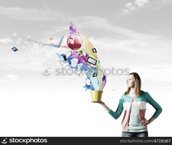 Woman with bucket. Young woman in casual holding yellow bucket with icons