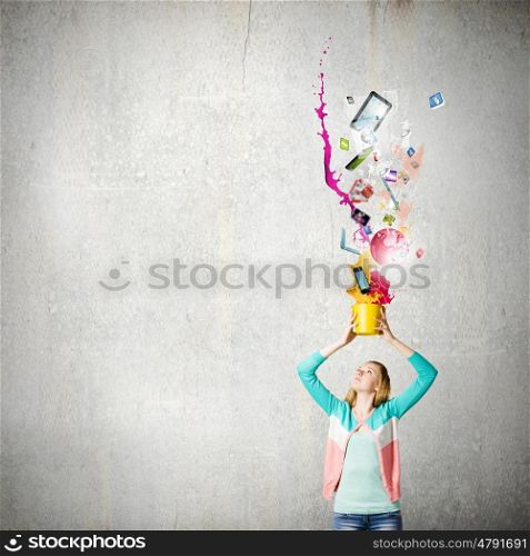 Woman with bucket. Young woman in casual holding yellow bucket with icons