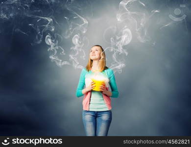 Woman with bucket. Young woman in casual with yellow bucket in hands