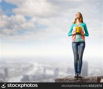 Woman with bucket. Young woman in casual with yellow bucket in hands