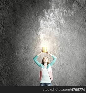 Woman with bucket. Young woman in casual with yellow bucket in hands