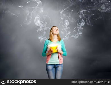 Woman with bucket. Young woman in casual with yellow bucket in hands