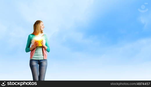 Woman with bucket. Young woman in casual with yellow bucket in hands