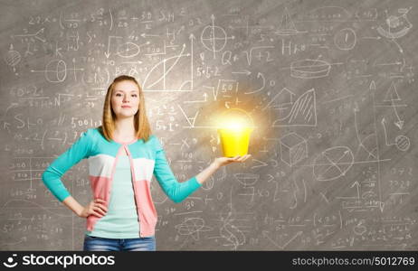 Woman with bucket. Young woman in casual with yellow bucket in hands