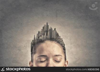 Woman with buildings instead of hair. Woman with modern urban landscape instead of her hair