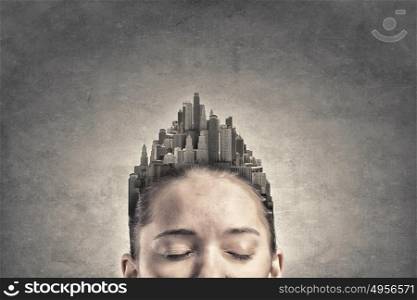 Woman with buildings instead of hair. Woman with modern urban landscape instead of her hair