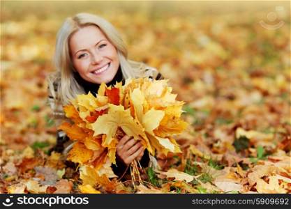 Woman with bunch of autumn orange maple leaves . Woman with bunch of autumn leaves
