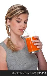 Woman with carrot juice on white background