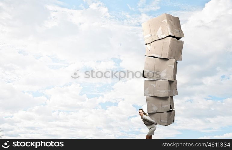 Woman with carton boxes. Businesswoman carrying big stack of carton boxes