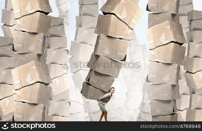 Woman with carton boxes. Businesswoman carrying big stack of carton boxes