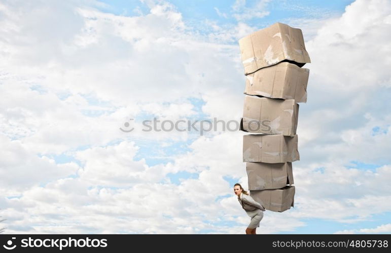 Woman with carton boxes. Businesswoman carrying big stack of carton boxes