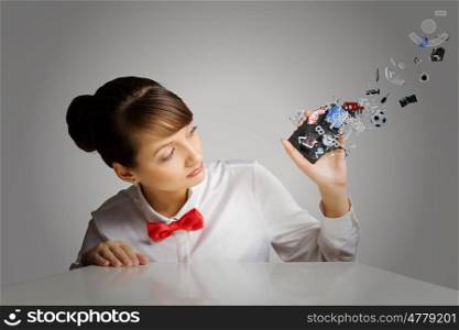 Woman with cellphone. Young woman holding mobile phone with icons