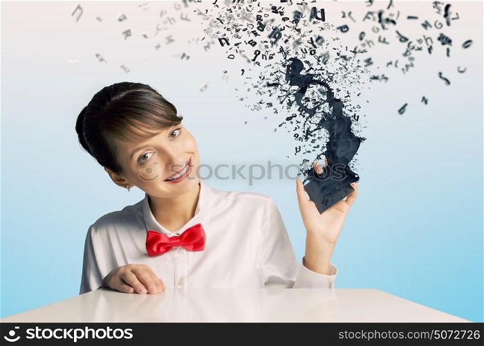 Woman with cellphone. Young woman holding mobile phone with splashes