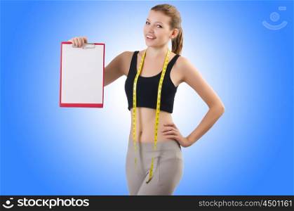 Woman with centimeter and paper binder