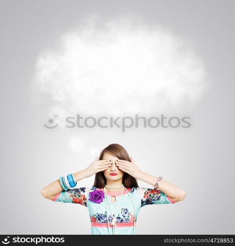 Woman with closed eyes. Young pretty woman hiding eyes with hands