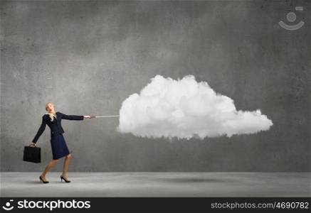Woman with cloud. Young businesswoman pulling white cloud with rope