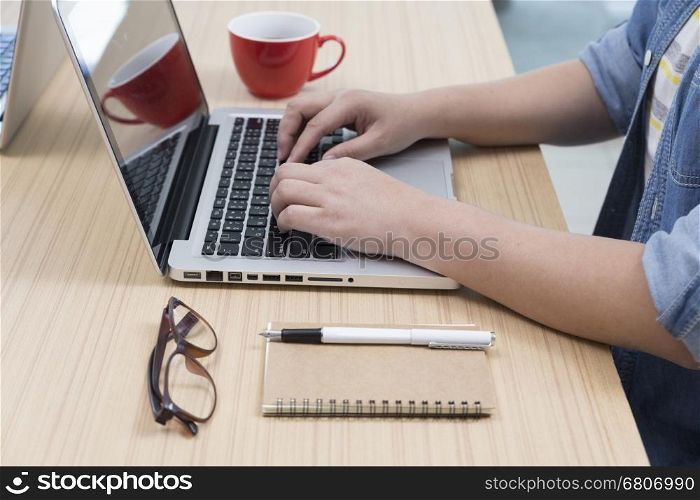 woman with coffee cup, laptop computer, notebook and pen for use as working concept