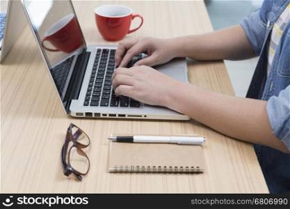 woman with coffee cup, laptop computer, notebook and pen for use as working concept