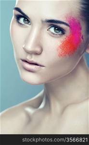 woman with coloured powder on face