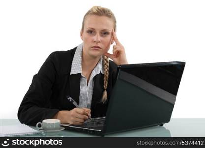 Woman with computer and coffee cup