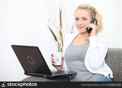 Woman with computer and coffee cup