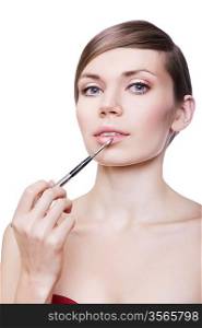 woman with cosmetic brush on lips on white background