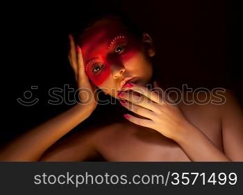Woman with Creative Make-up with Strass in her Face