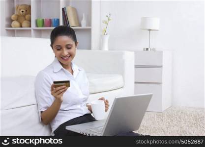 Woman with credit card and laptop
