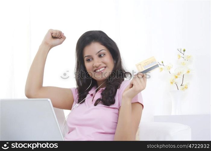 Woman with credit card shopping online