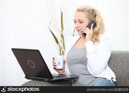 Woman with cup and computer
