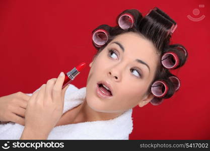 Woman with curlers and lipstick