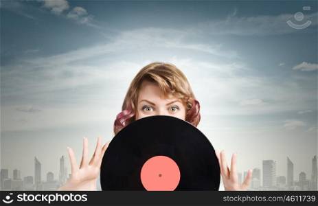 Woman with disco plate. Young woman in casual holding disco plate