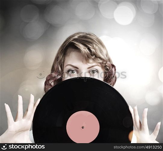 Woman with disco plate. Young woman in casual holding disco plate