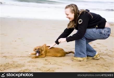 Woman With Dog Near The Ocean