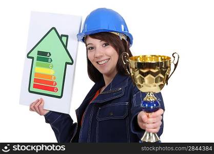 Woman with energy sign and trophy