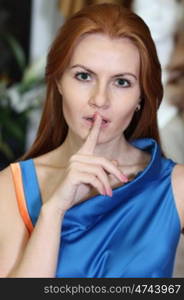 woman with finger on lips show quiet