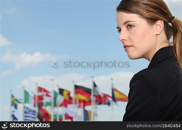 Woman with flags in the background