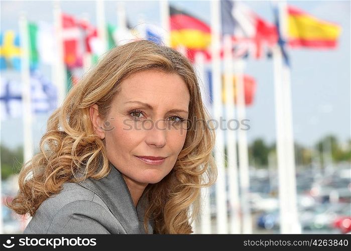 woman with flags in the background
