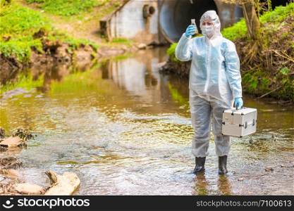 Woman with flask for expertise. Environmental pollution concept